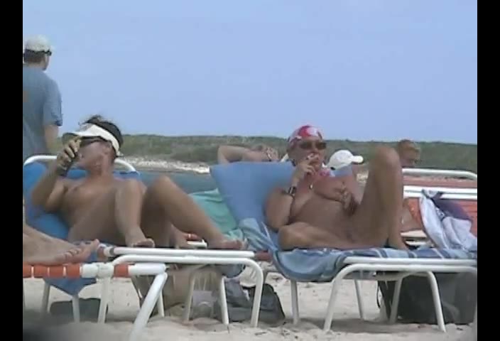 Nude Beach Spycam — Biker chick spreading for hidden camera on the beach